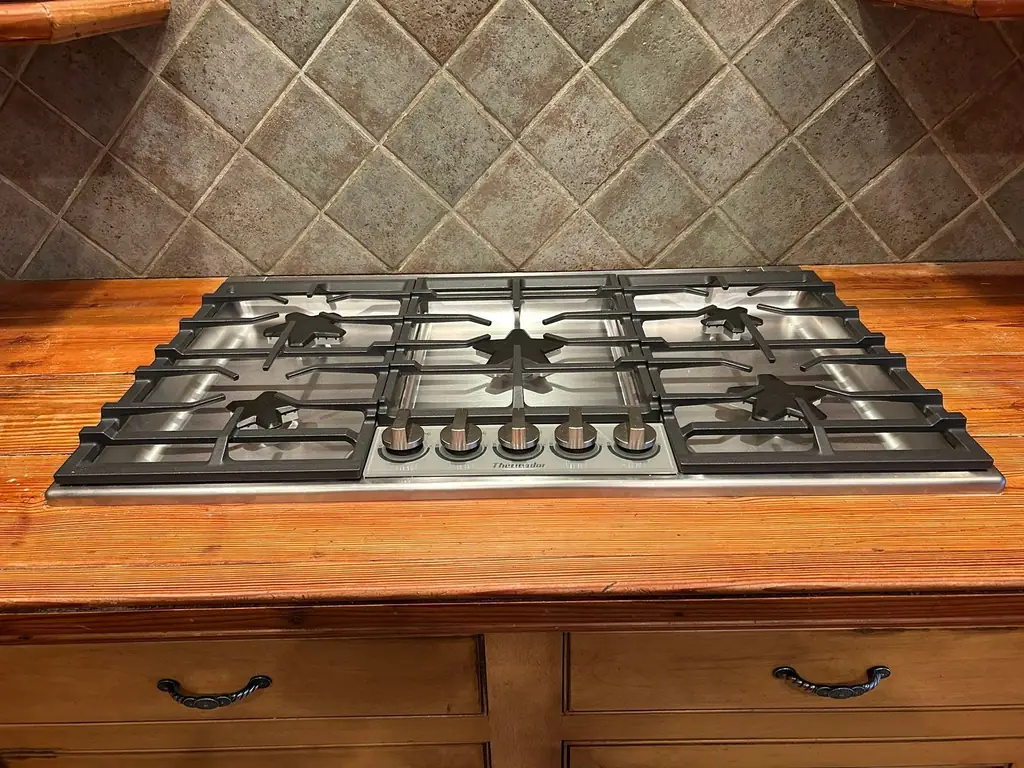 Gas cooktop installed in a butcher block counter