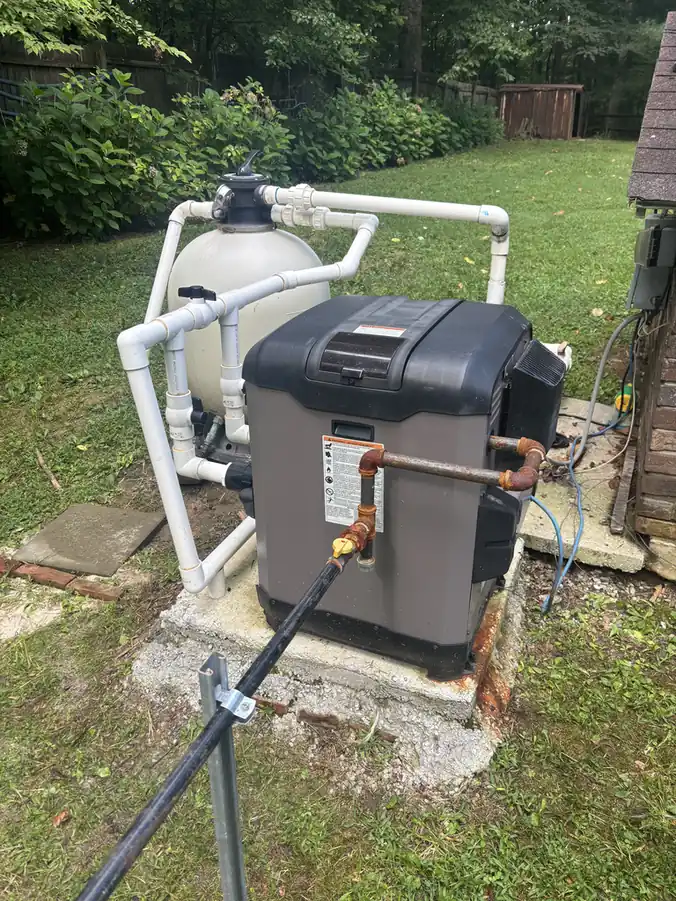 Gas pool heater installed with the pool equipment