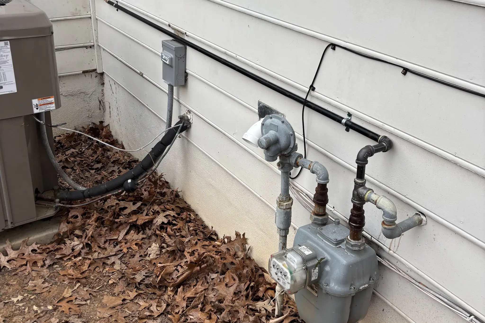 Two gas meters and new gas piping installed on a home by Hughes and Sons Gas