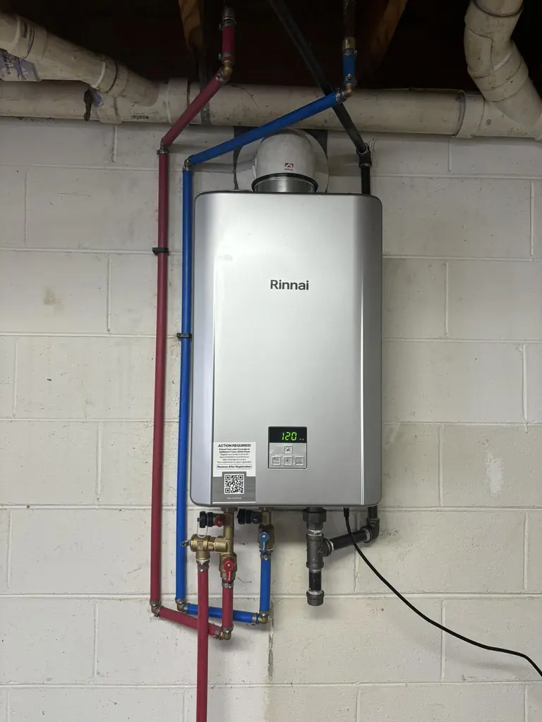 Tankless water heater on a finished wall