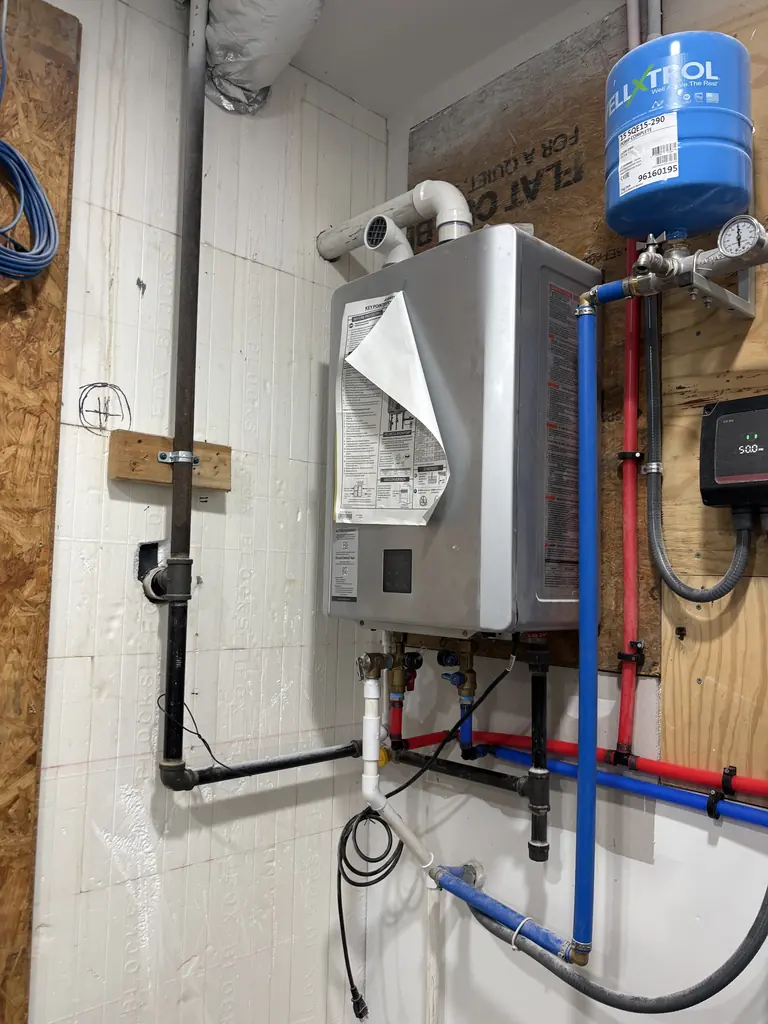 Tankless water heater with expansion tank