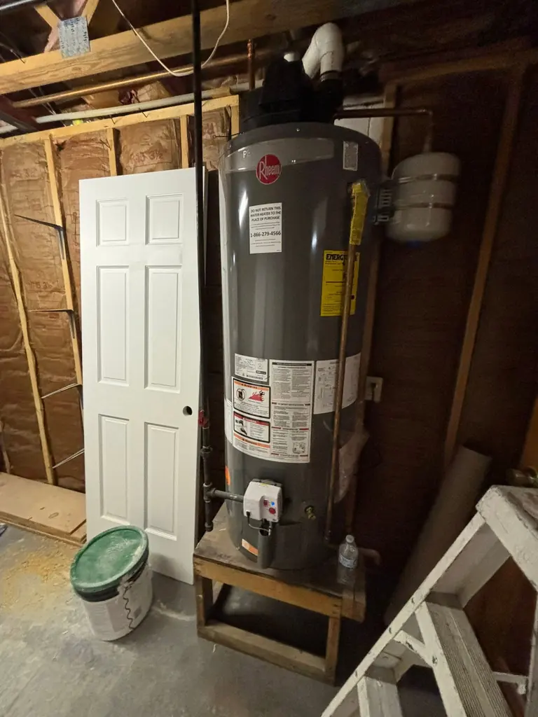 Tank water heater installed in a garage